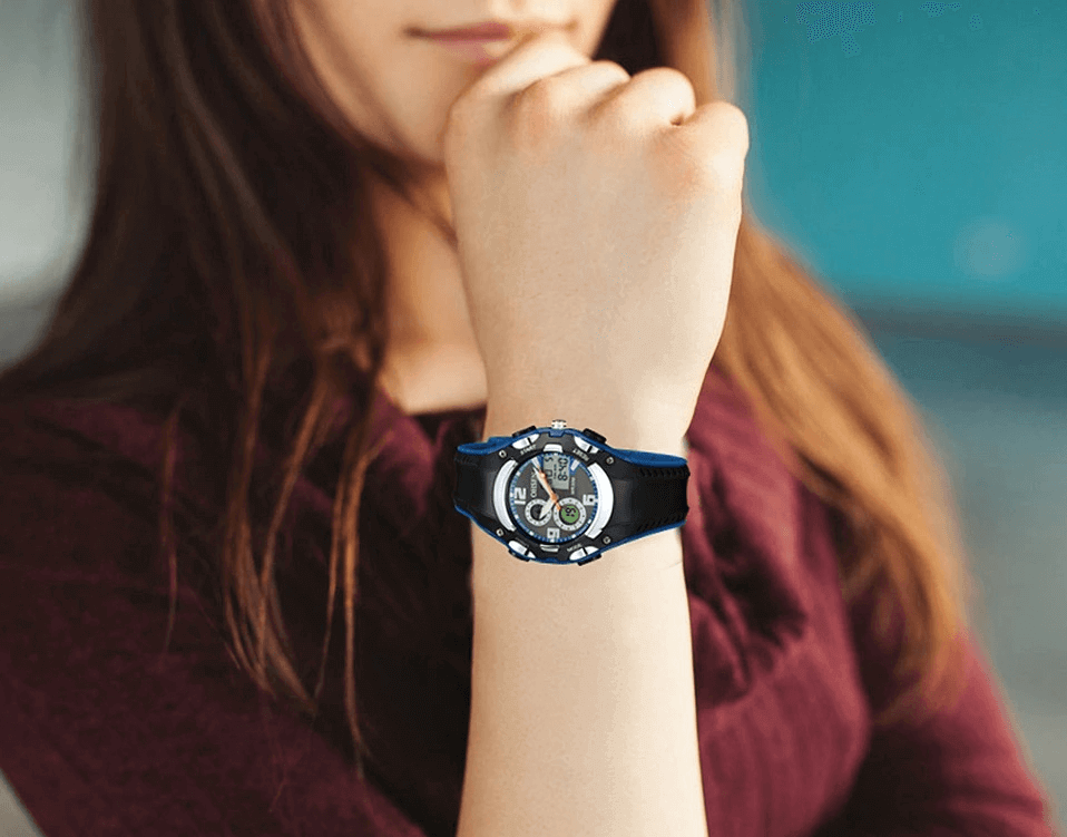Person wearing Digital Quartz Unisex Wristwatch SF0436 with silicone band, showcasing LED display and modern design.